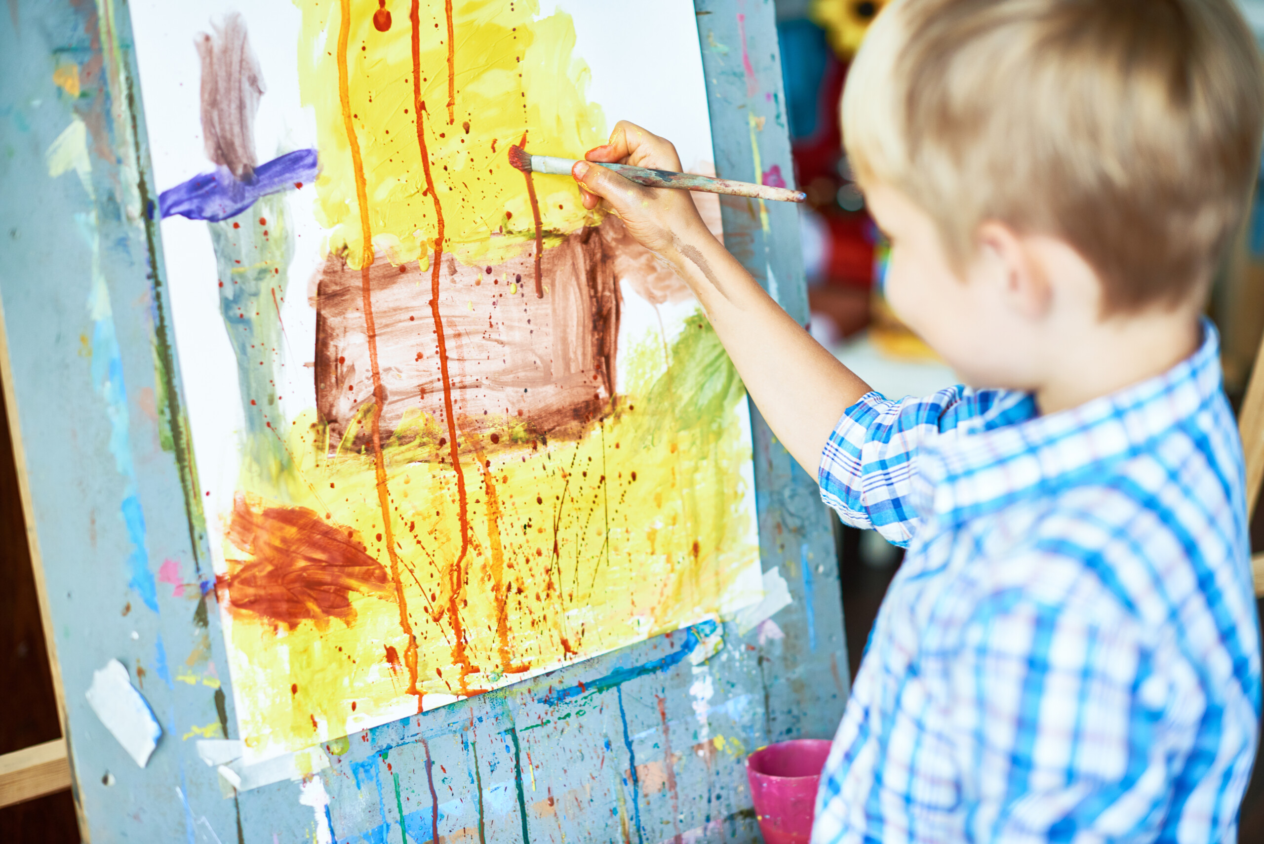 Little Boy Painting in Art Therapy